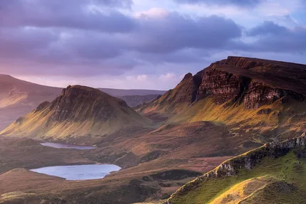 Sunrise whilst on top of the Quirang on the Isle of Skye.  The sky is purple and pink