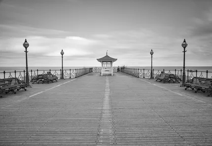 Swanage Pier perfectly symmetrical with a long exposure in black and white